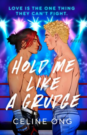 The cover art of HOLD ME LIKE A GRUDGE, a novel by Celine Ong, where two male wrestlers (to the left is an Asian man in his 20s with black hair tied up in a man bun and a red fringe cascading down his face, dressed in a pair of black wrestling tights designed to look like flames; to the right is a white man with short blond hair with slight curls at the top, dressed in white tights and blue lines coming up the side) square up in the middle of a ring. They stare at each other with a mix of fierceness and affection, and have an arm on each other. They are illuminated by pinkish, purplish, and blueish stage lights above. In the background, a faceless crowd watches them.