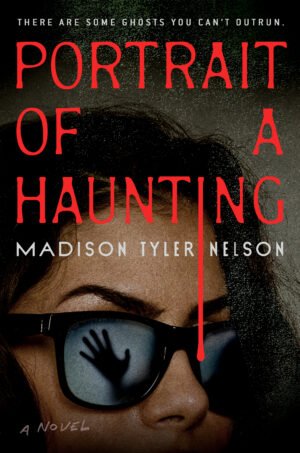 Cover for Portrait of a Haunting, showing a dark haired woman wearing sunglasses. In the reflection of the sunglasses, a ghostly hand appears to be reaching for her. The book typeset drips down the page like blood.