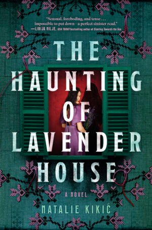 Cover the The Haunting of Lavender House, showing a white woman with shoulder-length dark hair looking out from the window of a house. The house has teal-green shutters, and the wall around it is also teal-green. The woman is wearing a lavender colored dress and she is looking over her shoulder at the viewer. In her hands, she is holding a bundle of lavender. Behind her, a dark silhouette of a person looms. The area around her, in the house, is colored an ominous bright red. Along the top and bottom of the cover are embroidered vines and flowers, resembling lavender. The book title is written in a bold, white font.